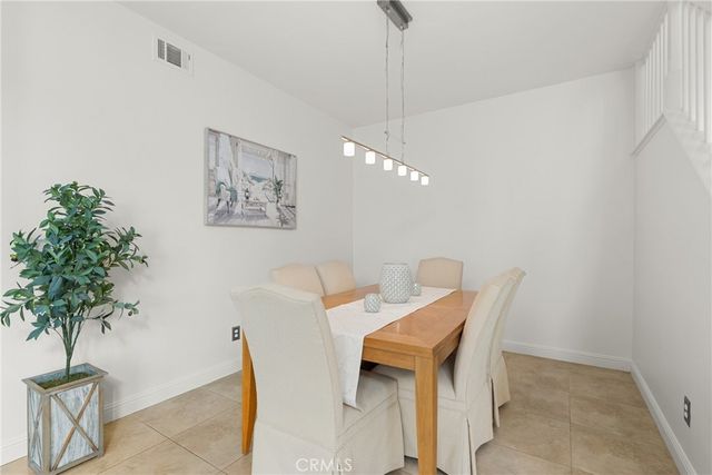 a view of walk in closet with clothes