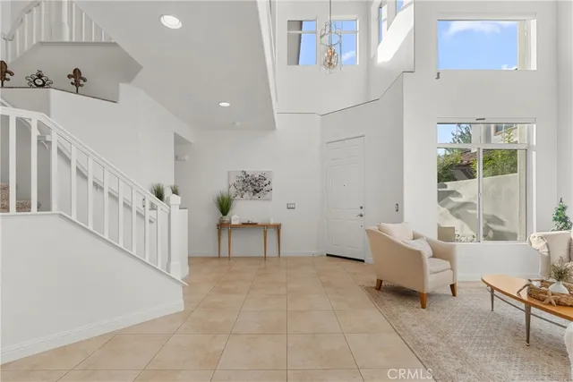 a kitchen with stainless steel appliances kitchen island granite countertop a sink and refrigerator