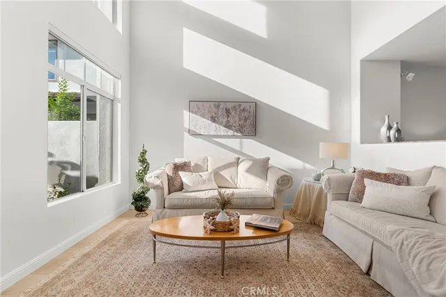 a kitchen with a refrigerator a sink a stove a microwave and island