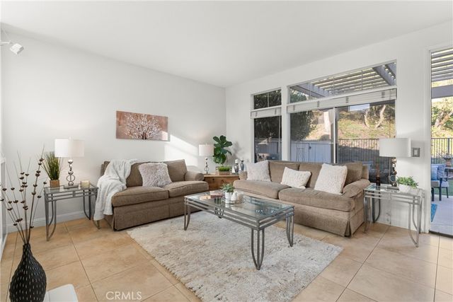 a view of backyard with seating area and green space