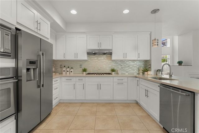 a view of backyard with seating space and trees