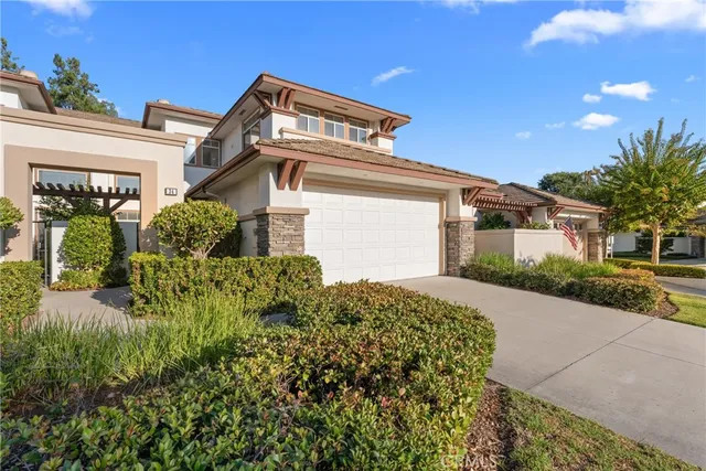 a couple of potted plants in front of door