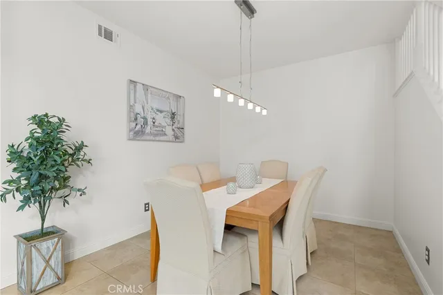 a kitchen with stainless steel appliances granite countertop a refrigerator sink and stove