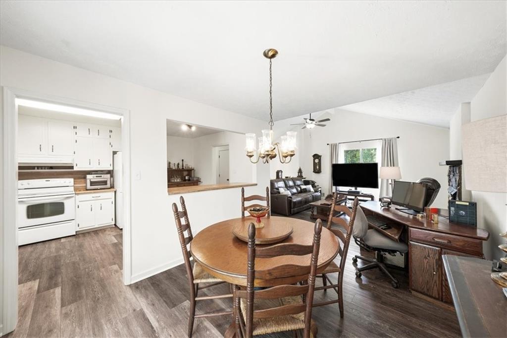 2561 Ripple Way Lawrenceville, GA 30043 - Photo 5 of 19 a view of a dining room with furniture window and wooden floor