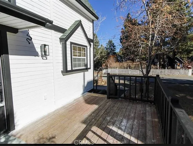 a view of a balcony with furniture