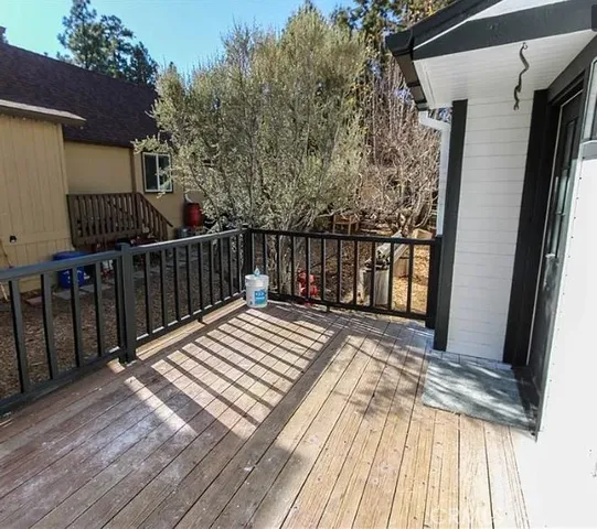 a view of balcony and wooden floor