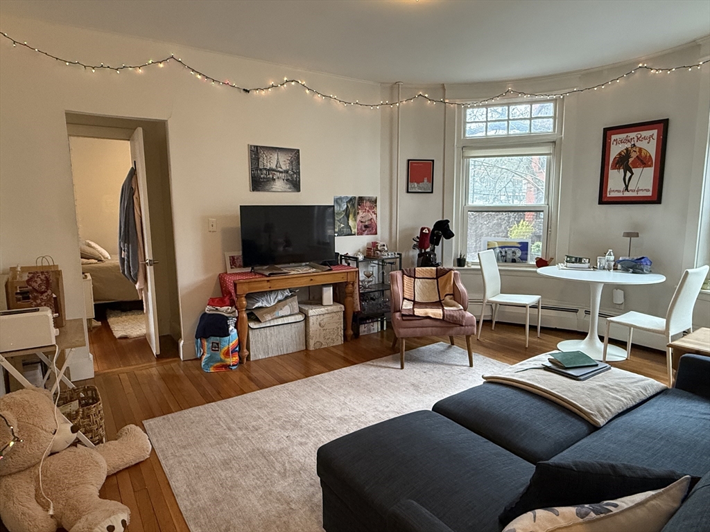 1871 Beacon Street, Unit 4 Brookline, MA 02445 - Photo 12 of 14 a living room with furniture and a flat screen tv