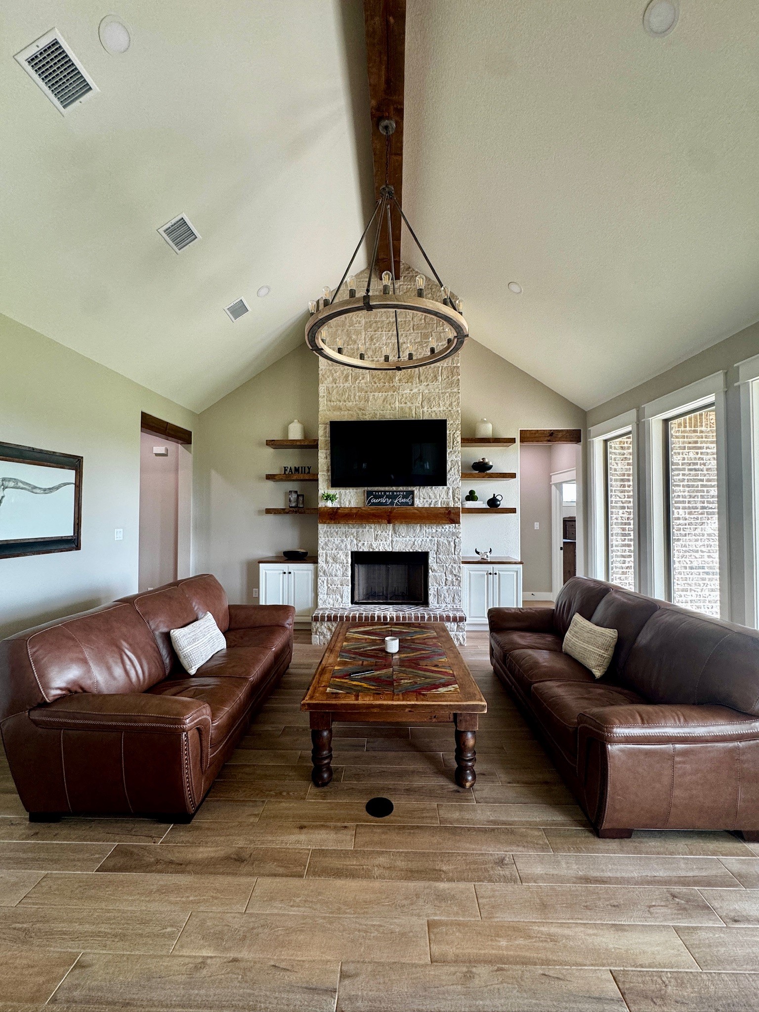 5854 Reliance Ridge Circle Bryan, TX 77808 - Photo 13 of 32 a living room with furniture a flat screen tv and a window