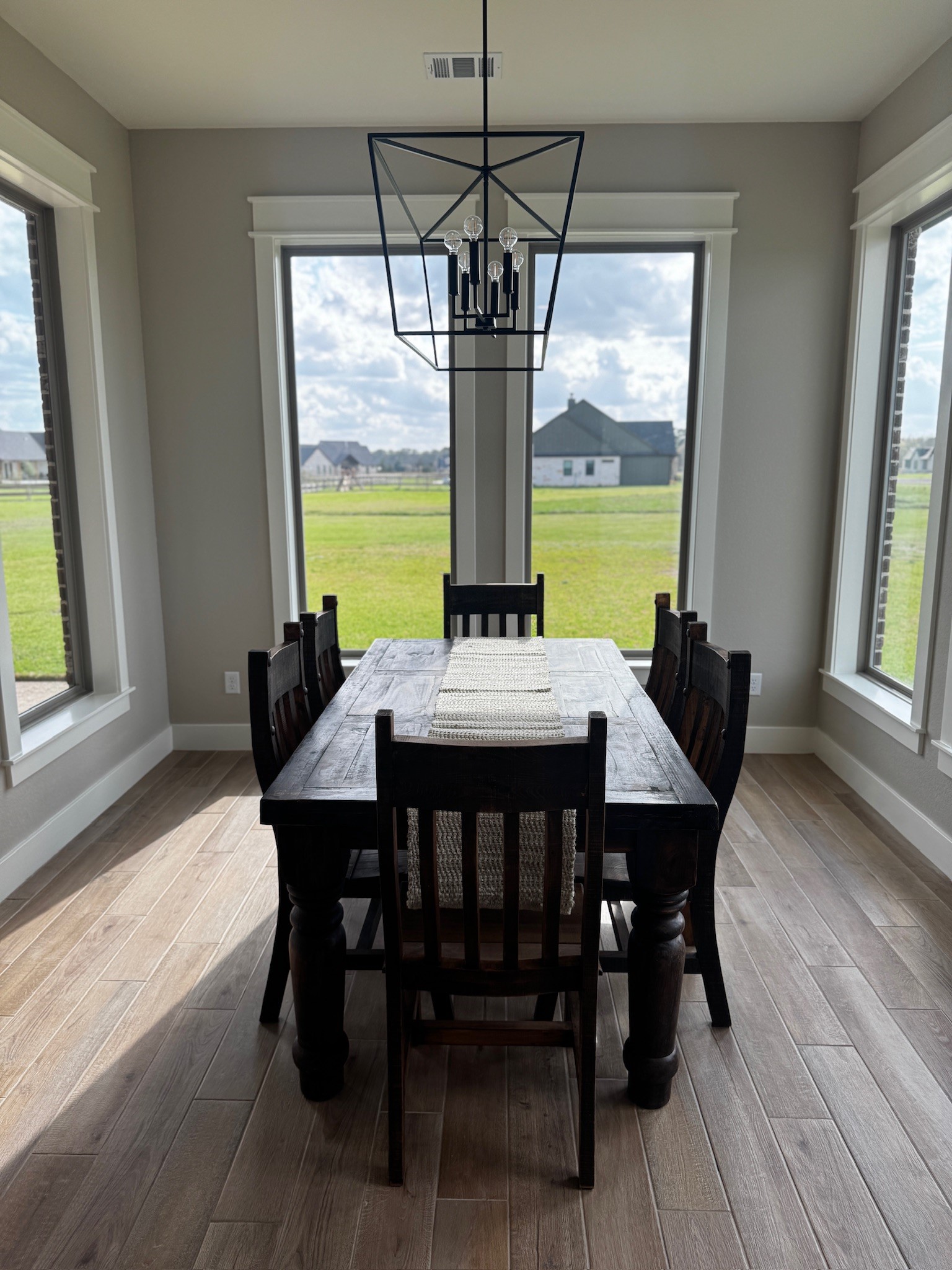 5854 Reliance Ridge Circle Bryan, TX 77808 - Photo 15 of 32 a view of a dining room with furniture window and wooden floor