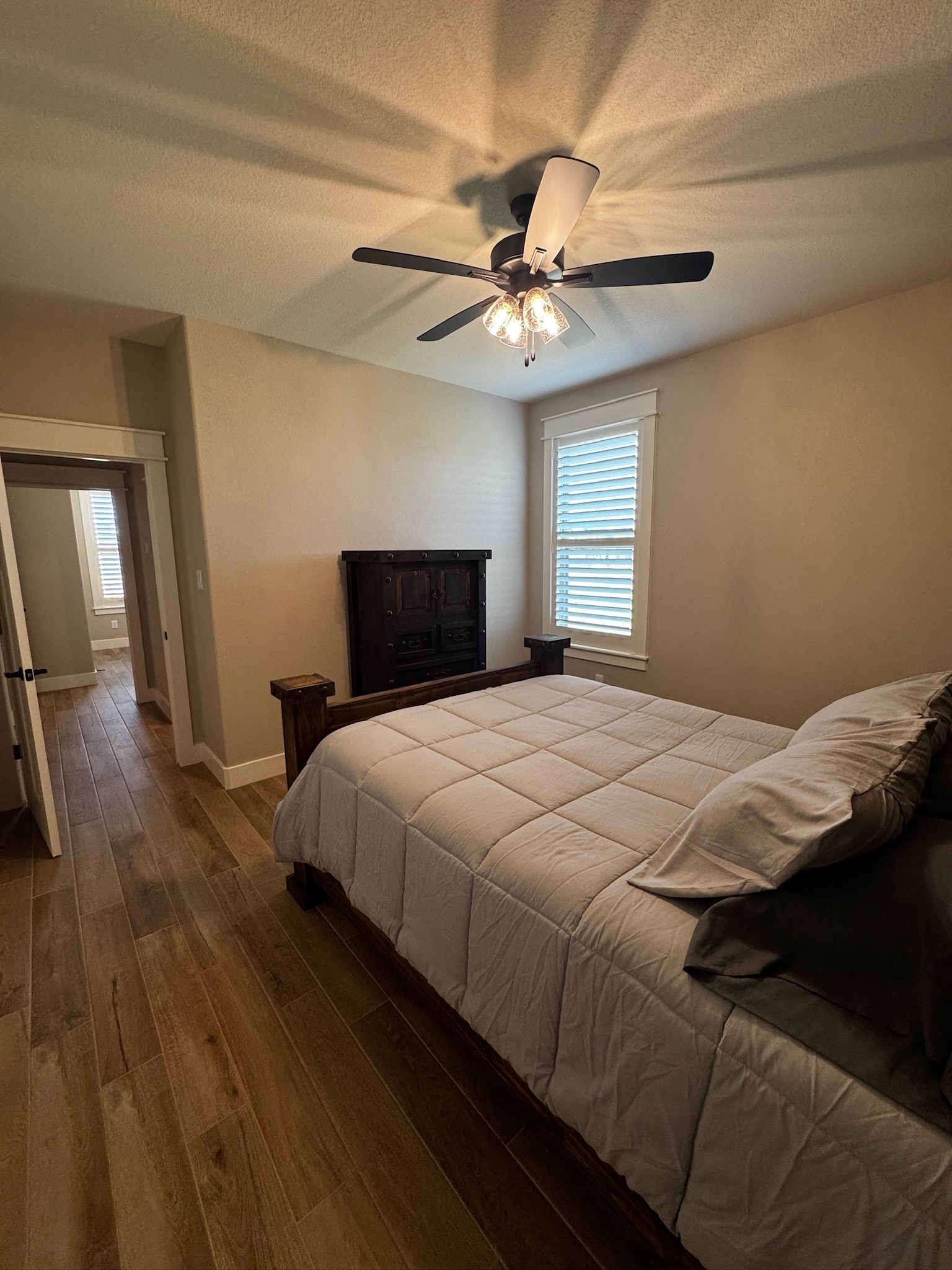 5854 Reliance Ridge Circle Bryan, TX 77808 - Photo 23 of 32 a bedroom with a bed and a ceiling fan