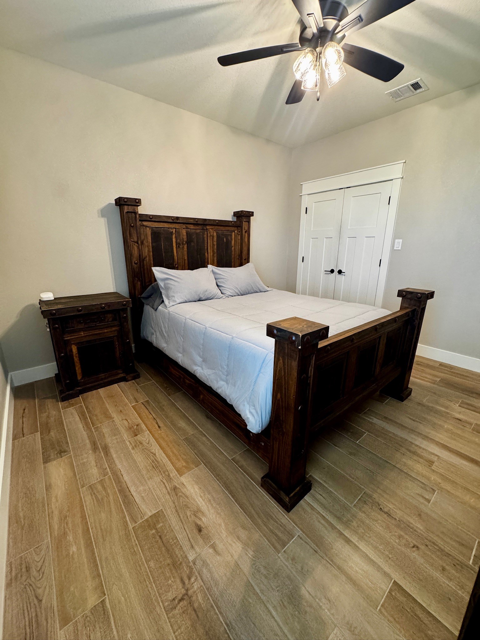 5854 Reliance Ridge Circle Bryan, TX 77808 - Photo 24 of 32 a bedroom with bed and wooden floor