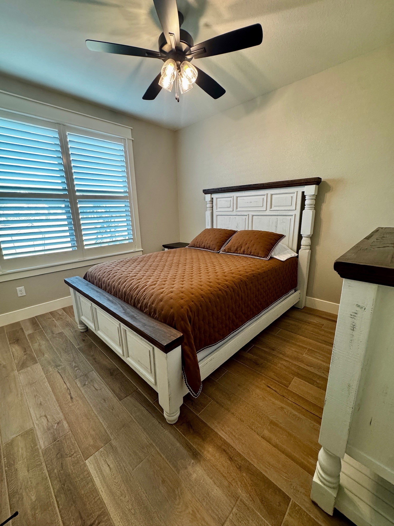 5854 Reliance Ridge Circle Bryan, TX 77808 - Photo 28 of 32 a bed sitting in a bedroom next to a window