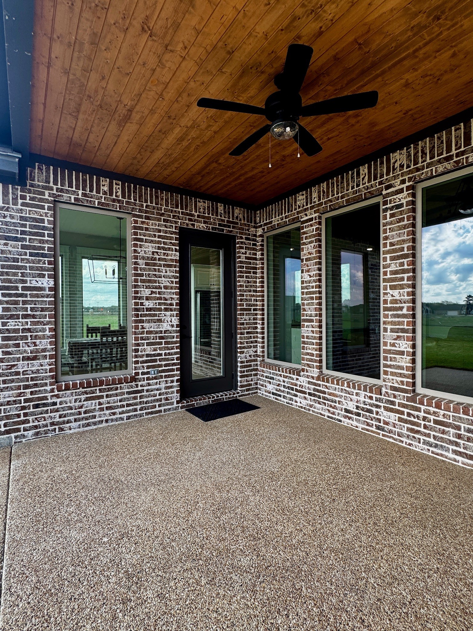 5854 Reliance Ridge Circle Bryan, TX 77808 - Photo 30 of 32 a view of a brick house with a large window