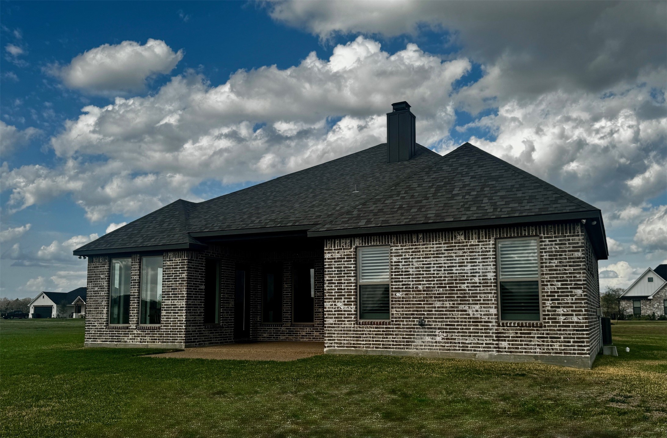 5854 Reliance Ridge Circle Bryan, TX 77808 - Photo 32 of 32 a front view of a house with a garden and yard