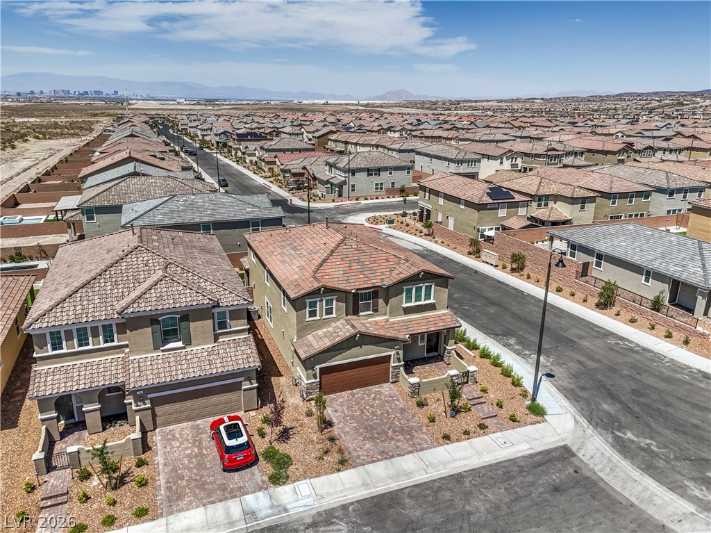 3782 Alla Rocca Avenue Henderson, NV 89044 - Photo 44 of 55 This captivating aerial view showcases a vibrant neighborhood under a clear sky.