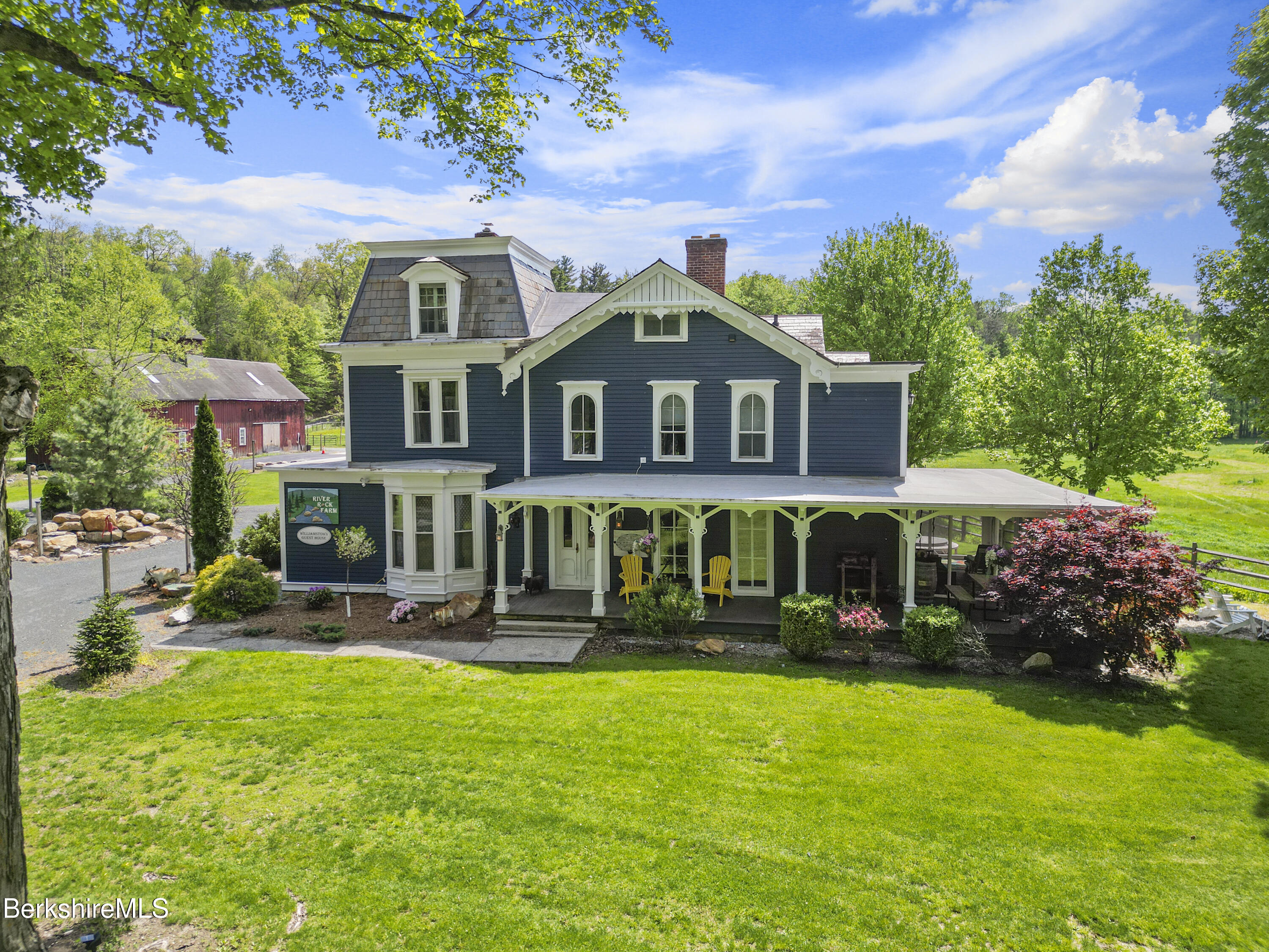295 Blair Road Williamstown, MA 01267 - Photo 98 of 115 a front view of a house with garden and trees