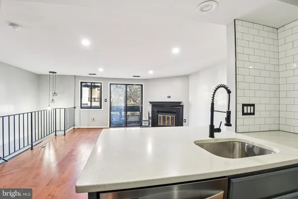 a kitchen with a sink and a refrigerator