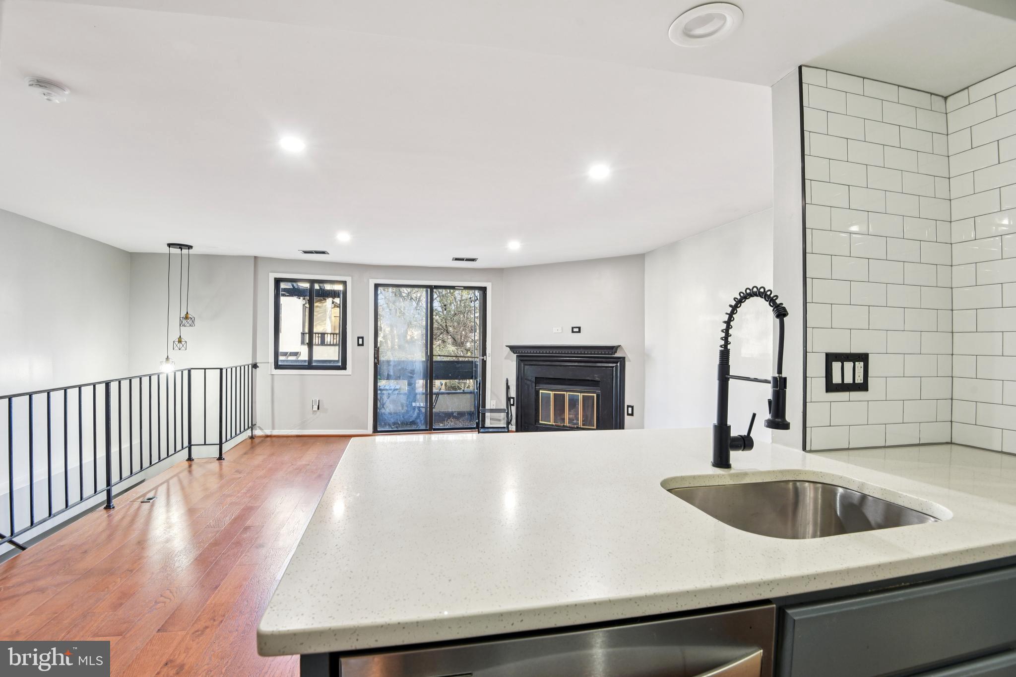 9717 Hellingly Place, Unit 48 Gaithersburg, MD 20886 - Photo 11 of 32 a kitchen with a sink and a refrigerator