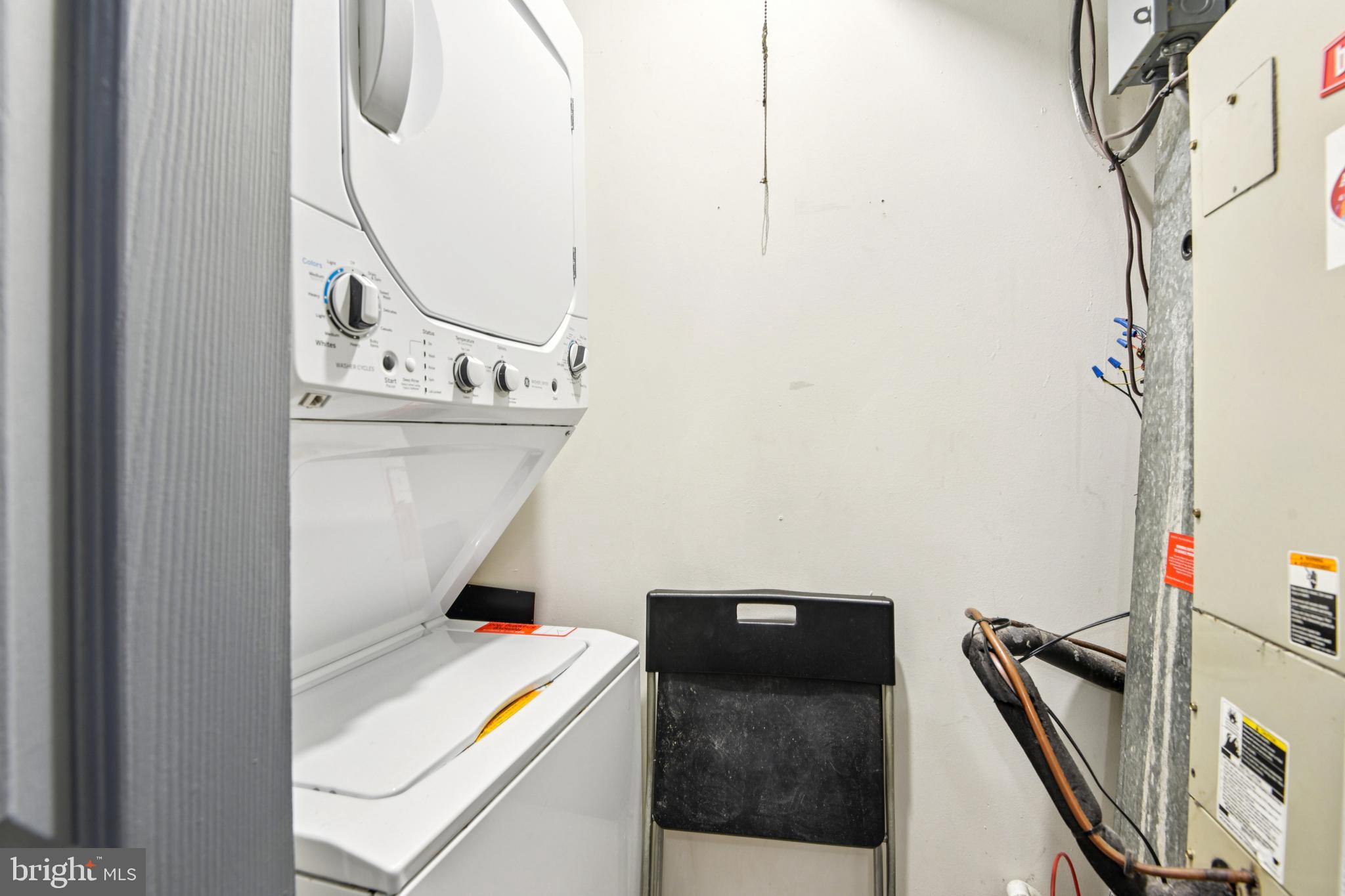 9717 Hellingly Place, Unit 48 Gaithersburg, MD 20886 - Photo 14 of 32 a utility room with dryer and washer