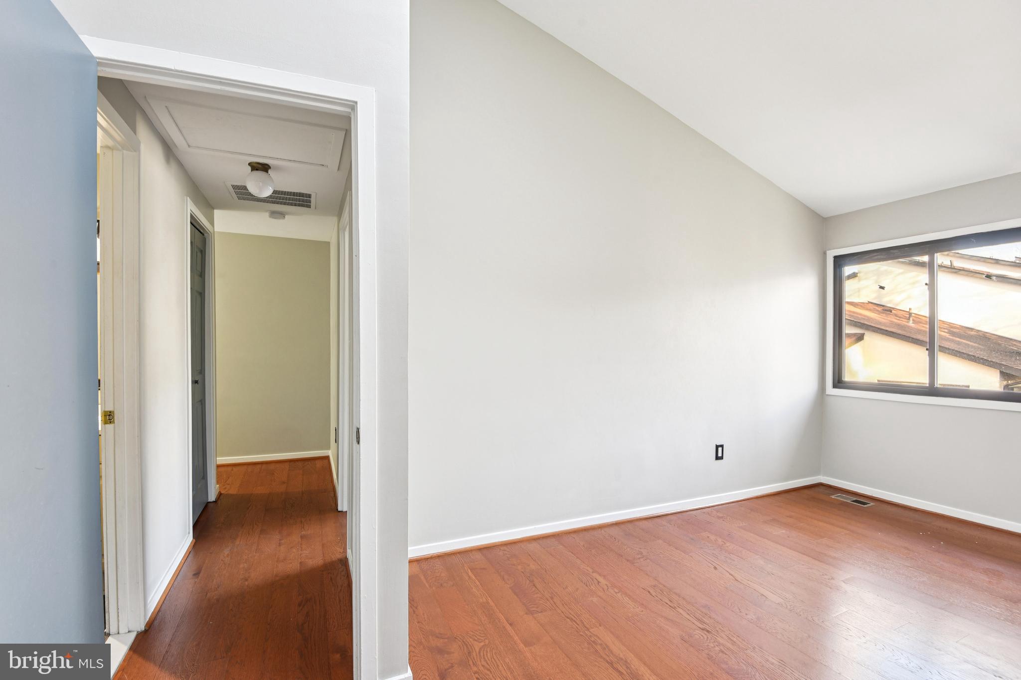 9717 Hellingly Place, Unit 48 Gaithersburg, MD 20886 - Photo 20 of 32 an empty room that has a window