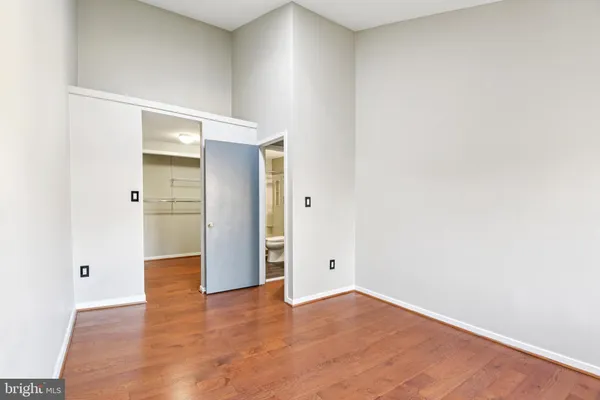 an empty room with wooden door