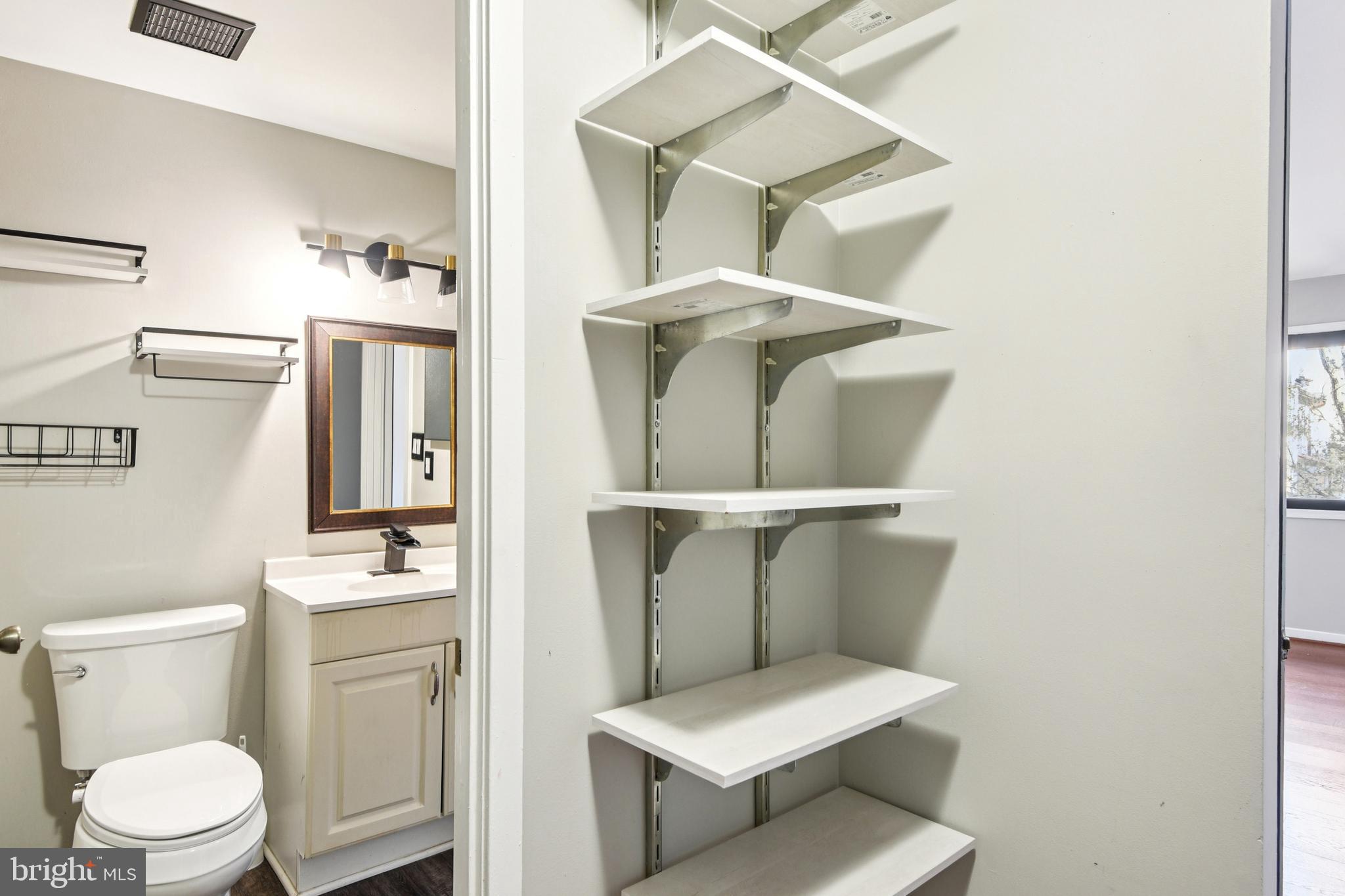 9717 Hellingly Place, Unit 48 Gaithersburg, MD 20886 - Photo 26 of 32 a bathroom with a toilet and a sink