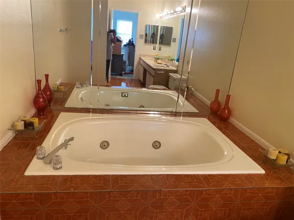 a bathroom with a glass door shower