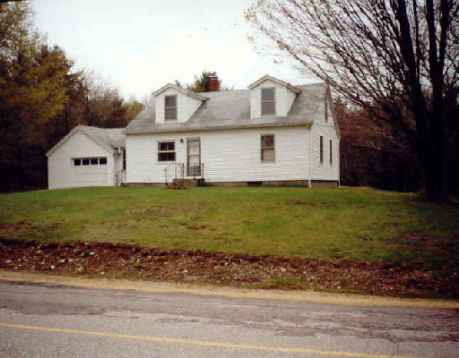 29 Oxbow Road Charlton, MA 01507 - Photo 1 of 1 a white house that has a tree in front of it