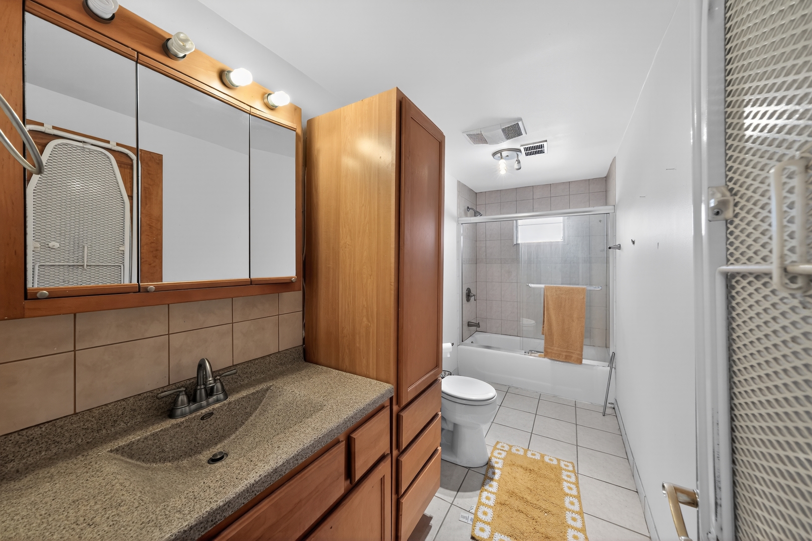 7315 Arcadia Street Morton Grove, IL 60053 - Photo 11 of 15 a bathroom with a sink toilet and shower