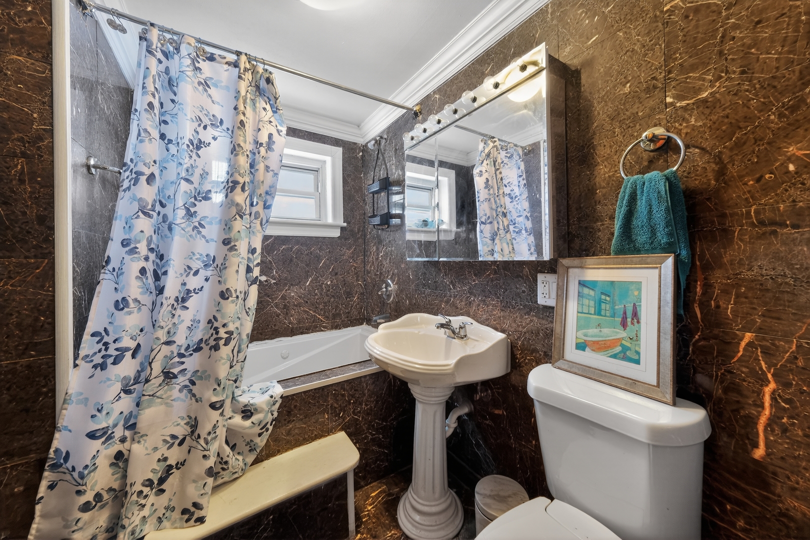 7315 Arcadia Street Morton Grove, IL 60053 - Photo 14 of 15 a bathroom with a sink toilet and mirror