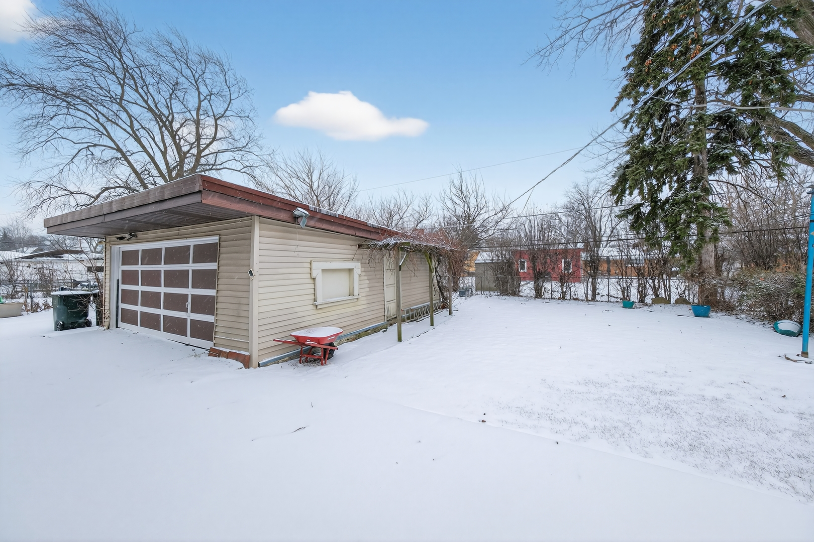 7315 Arcadia Street Morton Grove, IL 60053 - Photo 15 of 15 a view of a house with a snow in the yard