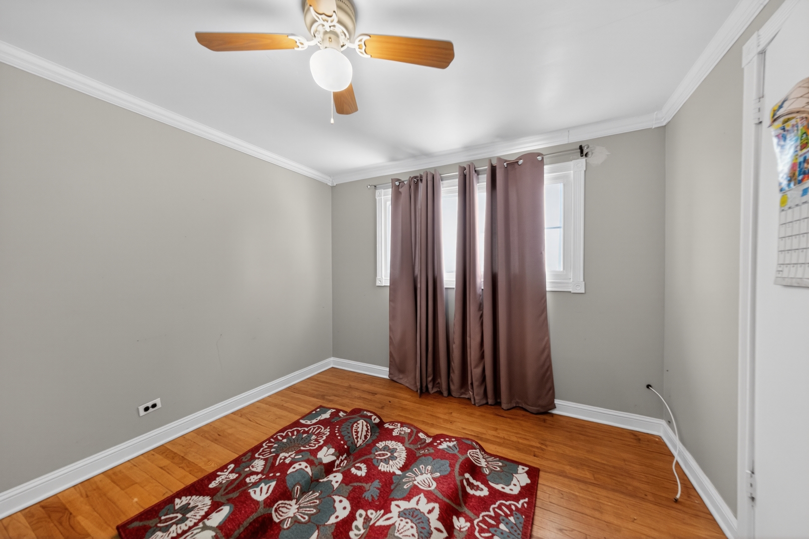 7315 Arcadia Street Morton Grove, IL 60053 - Photo 6 of 15 a view of a room with wooden floor