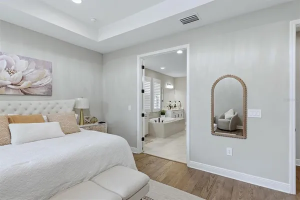 a bathroom with a sink a toilet a mirror and shower curtain