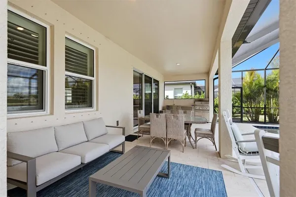 a view of a livingroom with furniture and a flat screen tv