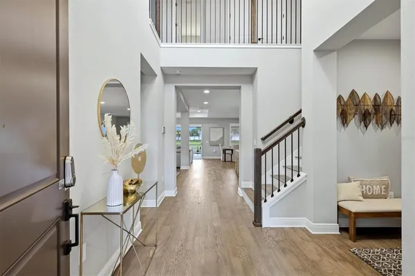a kitchen with white cabinets and sink