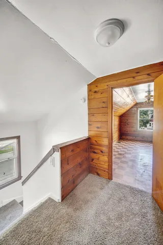 a view of room with window and wooden floor