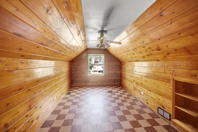 a view of an empty room and a window