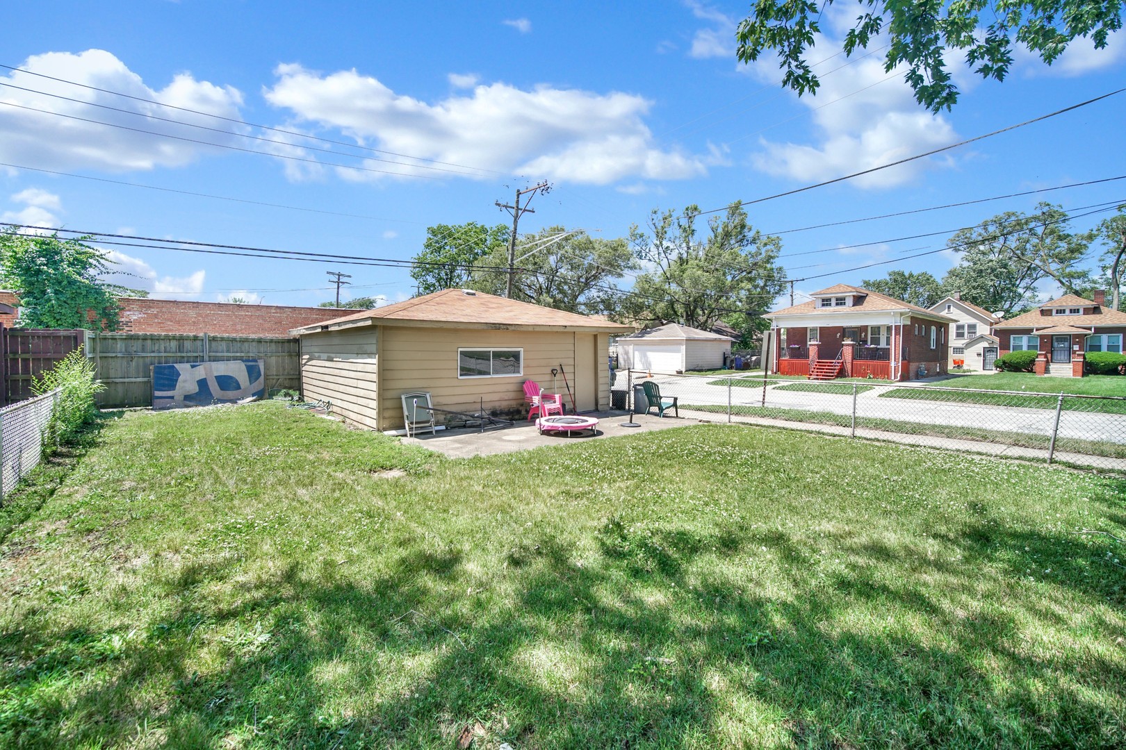 14528 Grant Street Dolton, IL 60419 - Photo 21 of 26 a aerial view of a house with swimming pool having outdoor seating
