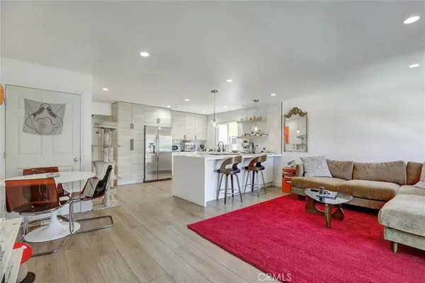 a kitchen that has a sink and a stove in it
