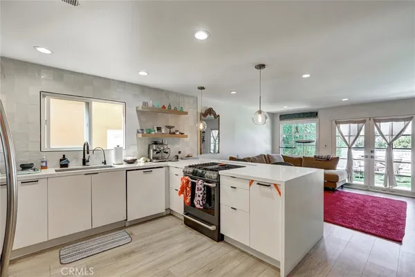 a spacious bedroom with a bed and a couch