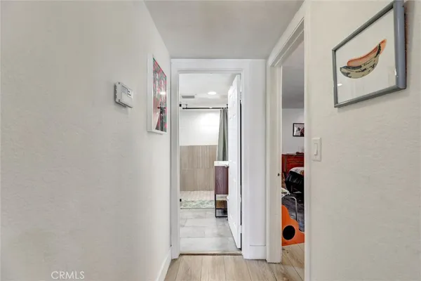 a kitchen with kitchen island granite countertop a stove refrigerator and cabinets