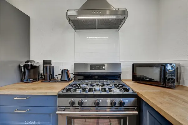 a bedroom with a bed a table and chair