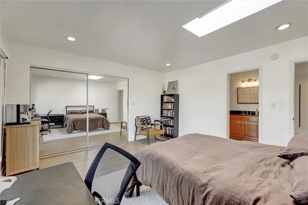 a view of a swimming pool and outdoor seating