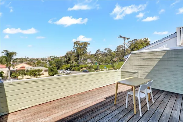 a bedroom with a bed a television and a large window