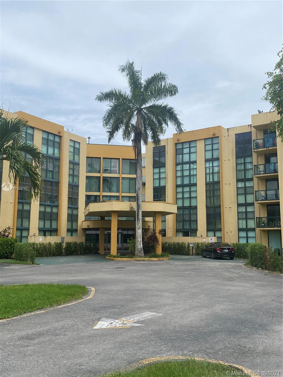 11790 Southwest 18th Street, Unit 1073 Miami, FL 33175 - Photo 1 of 18 a front view of building with yard