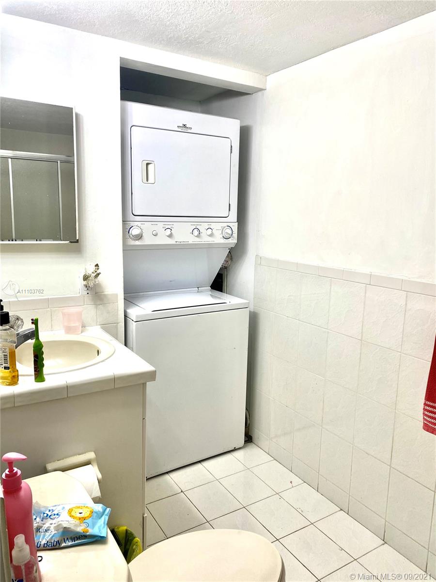 11790 Southwest 18th Street, Unit 1073 Miami, FL 33175 - Photo 12 of 18 a bathroom with a sink a vanity and a mirror