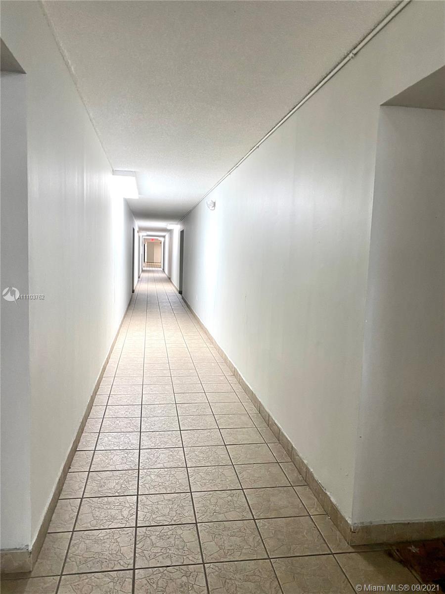 11790 Southwest 18th Street, Unit 1073 Miami, FL 33175 - Photo 3 of 18 a view of an empty room and window