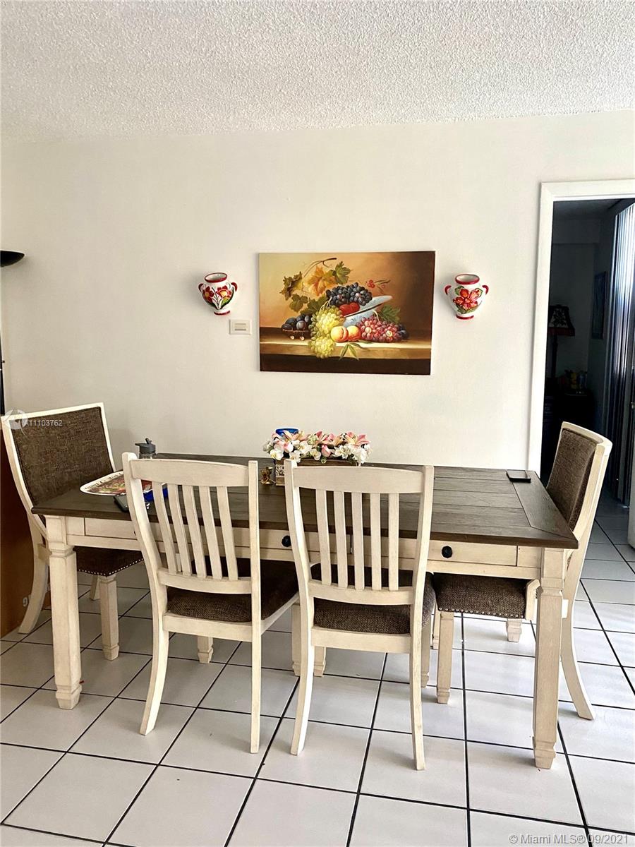 11790 Southwest 18th Street, Unit 1073 Miami, FL 33175 - Photo 7 of 18 a view of a dining room with furniture