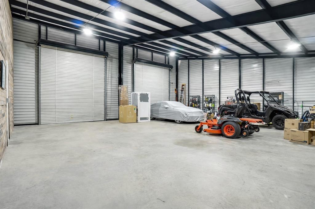 13240 Briar Road Azle, TX 76020 - Photo 34 of 39 a view of a garage with cars