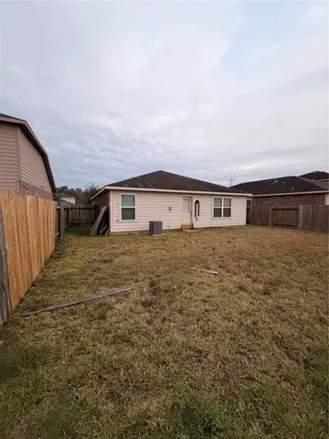 a big house with a big yard and large trees